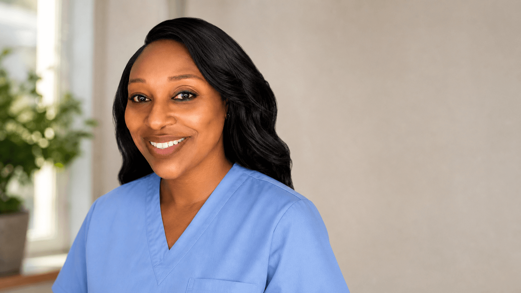 Tasha Johnson in blue scrubs